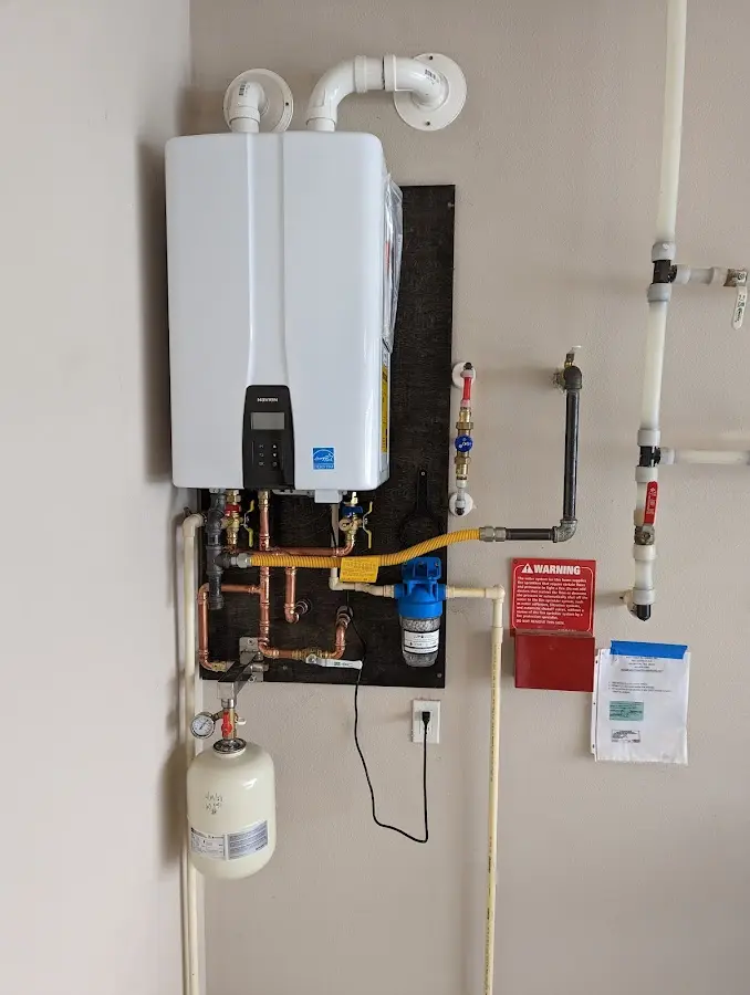 Professional plumber installing copper piping in a Cudahy home